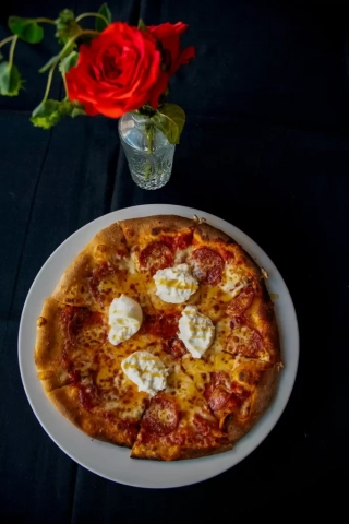 Pizza and rose at Ferrucci Ristorante in Downtown Panama City